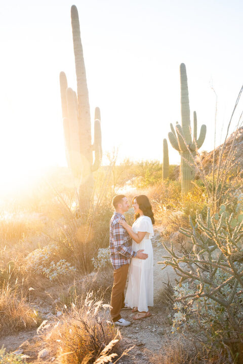 saguaro cactus and sunset with couple in the desert
